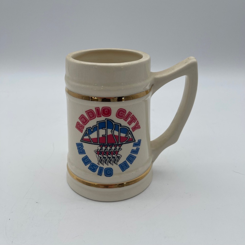 Vintage Radio City Music Hall Rockettes Ceramic Beer Stein Mug Gold Trim Cream
